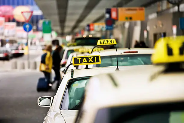 German Taxis at an airport in a row.