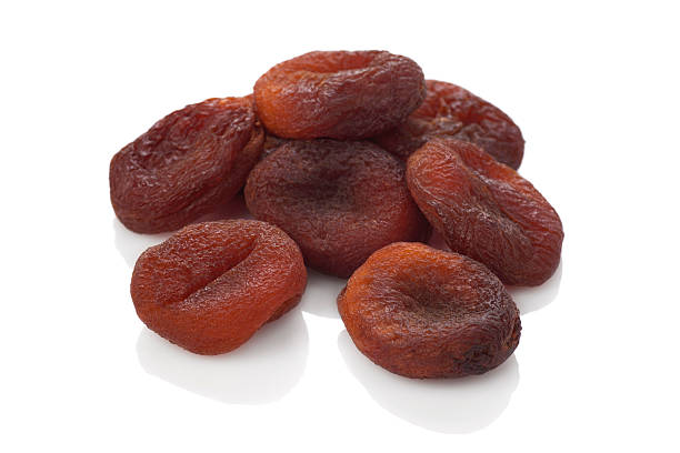 Sun dried apricots on the white background.Natural fruit. stock photo