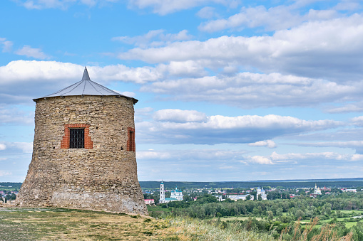 White stone tower, fortress-mosque of 12th century, Yelabuga,Russia. Only surviving structure of military fortress of Volga Bulgarians of pre-Mongol period.Devil s hillfort.View of historical downtown