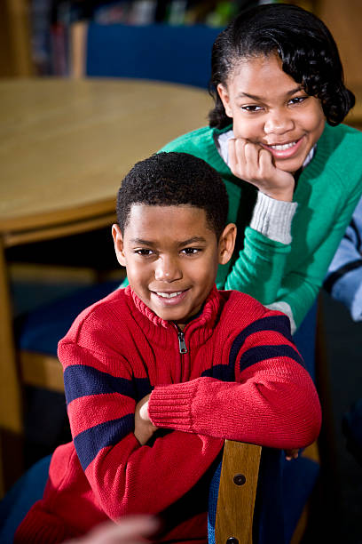 istock African American children sitting in school library 183799308