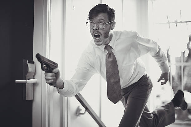 A spy or undercover agent with a goofy facial expression runs into a corridor hallway of a dark hotel, gun in hand.  Big chops sideburns, classy mustache, and glasses. Horizontal with copy space; black and white.  GRAIN ADDED.