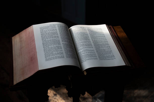 istock Bible on A Dark Background. Selective focus. Shallow Depth of Field 1837997926