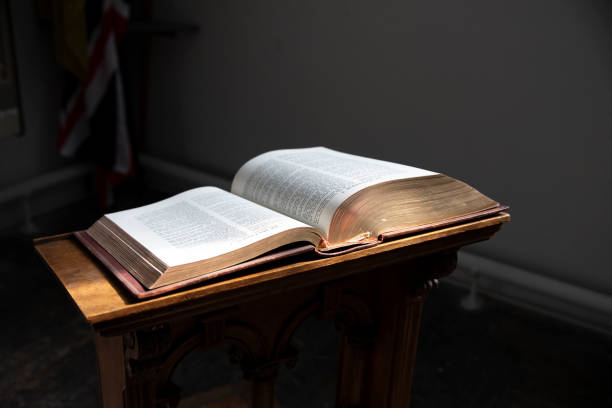 istock Bible on A Dark Background. Selective focus. Shallow Depth of Field 1837998270