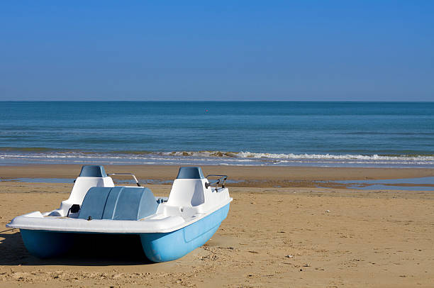 pedal boats on beach