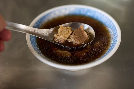 Mutton soup made with traditional Chinese medicine. Taiwanese traditional famous and delicious street food in Taiwan, traditional cuisine in Taiwan. Close up of top view Chinese style food, usually can be founded in night market.
