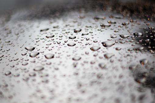Raindrops on a window glass close up