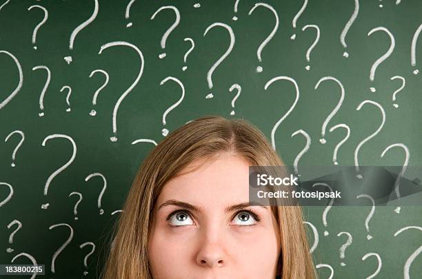Chalk Question Marks Above Woman At Blackboard Stock Photo - Download Image Now - Confusion, Question Mark, Women