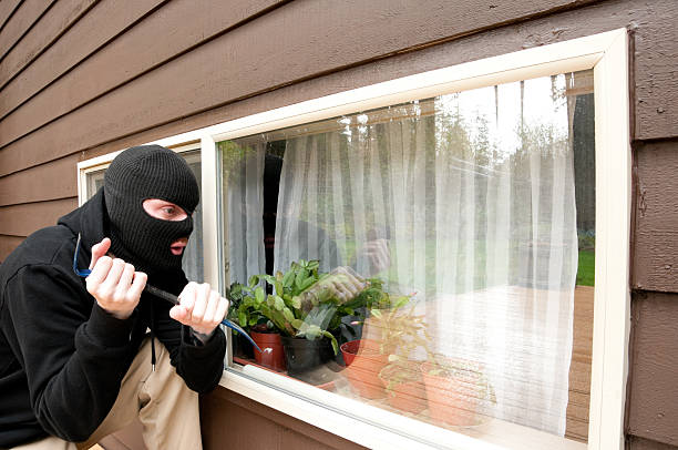 istock Masked man breaking into a house 183800306
