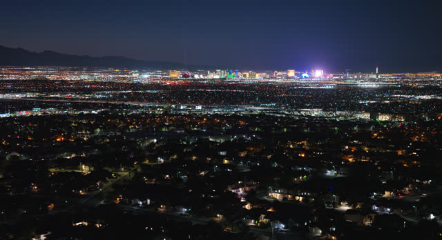 Rightward Establishing Aerial Shot of Henderson, Nevada at Night with The Strip in the Distance