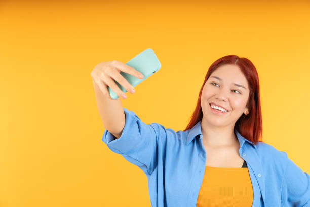 istock A young smiling woman taking a selfie 1838009160