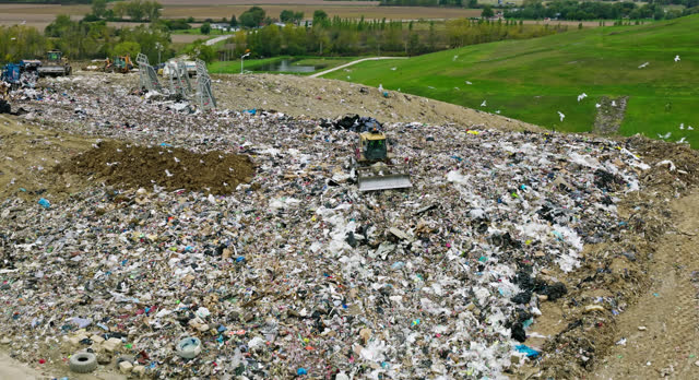 Ascending Aerial Shot Tilting down on Landfill in Ottawa County, Ohio on Overcast Day