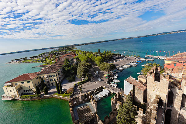 Sirmione stands on a peninsula that stretches out for about 4 km in the Lake Garda, surrounded by clear waters. It is the most visited and loved locality around the lake, appreciated for its climate and for the medieval borough with all the history enclosed by its walls. An example is the imposing thirteenth-century castle, the Rocca Scaligera, that dominates the town. 