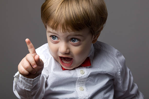 Little Boy With Blonde Hair Shaking His Finger For Warning Little Boy With Blonde Hair Shaking His Finger For Warning bossy stock pictures, royalty-free photos & images