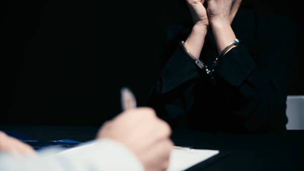 istock A crime suspect in handcuffs is feeling shocked and denying involvement during interrogation 1838017673