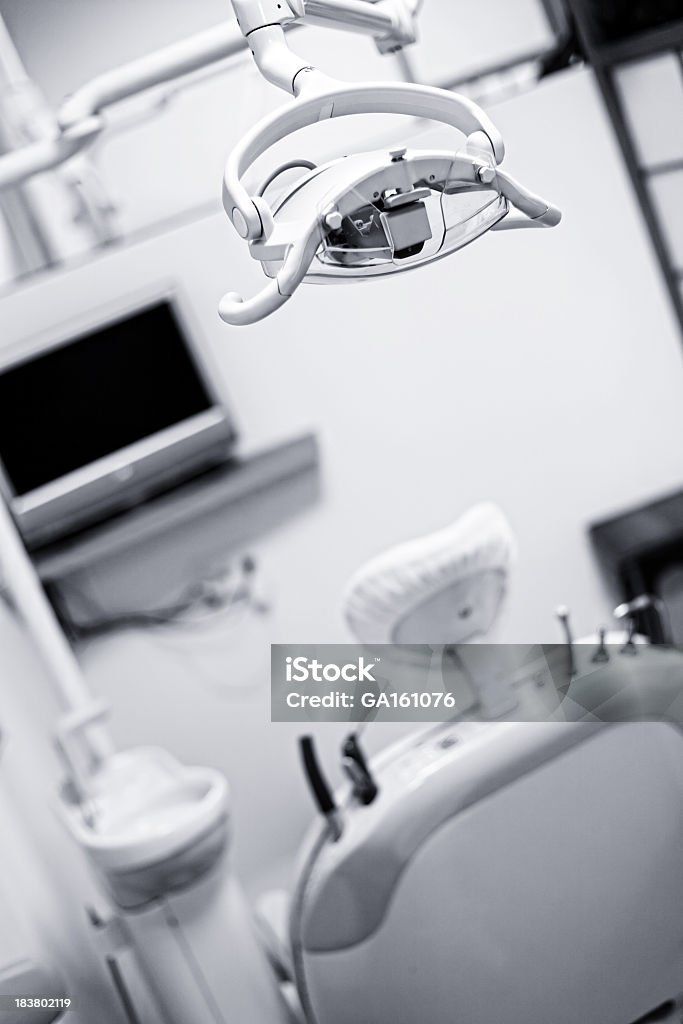 Dentist exam room A dental exam room. Blue toned Beauty Stock Photo