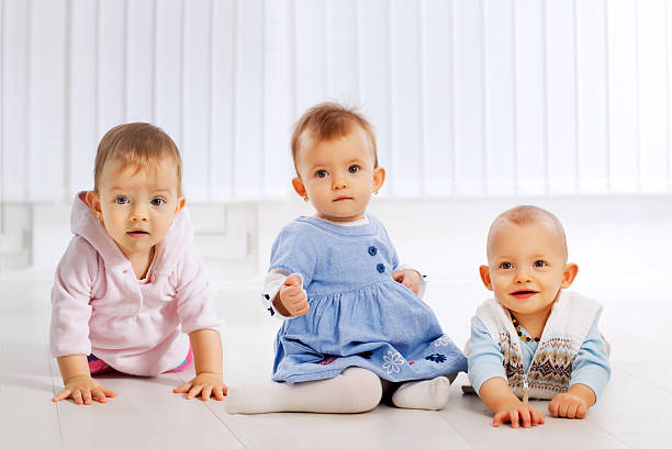 istock Friendship of three beautiful little babies. 183802386