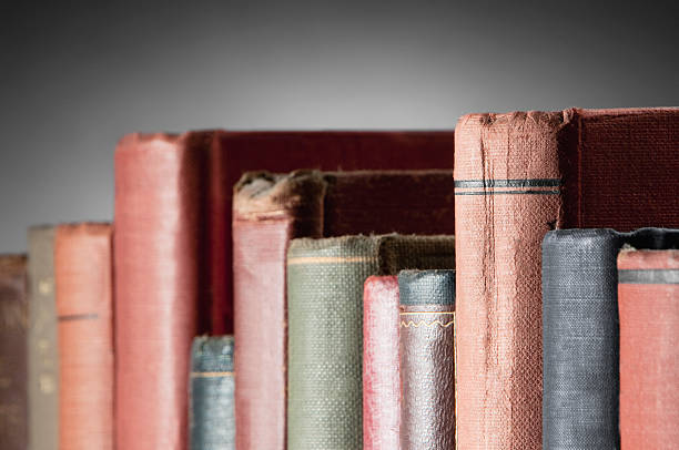 istock Row of old leather covered books on bookshelf 183802390