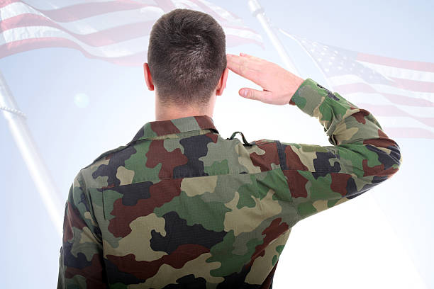 istock Saluting to American flag 183802626