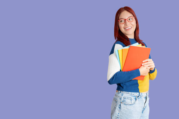 istock Young woman carrying her notebooks 1838026883