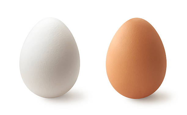 White and brown eggs stock photo