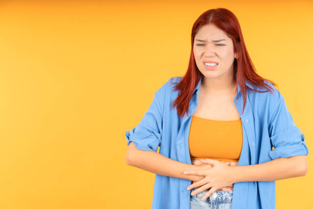 istock Young woman with stomach cramps 1838029041