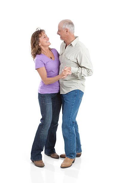 istock Attractive Happy Mature Couple Dancing on White Background 183803487