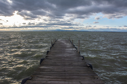 Dramatic view of the Albufera Lake in a cloudy, stormy day in El Palmar, Valencia, Spain