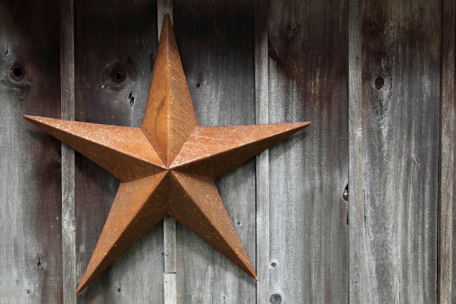 Rusty Texas Star on the side of a weathered old barn