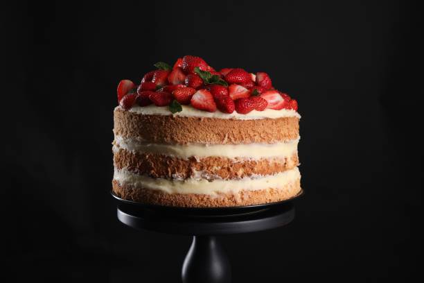 istock Tasty cake with fresh strawberries and mint on black background 1838040685