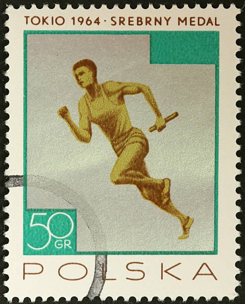 istock baton carrying relay racer on an old Polish stamp 183804100