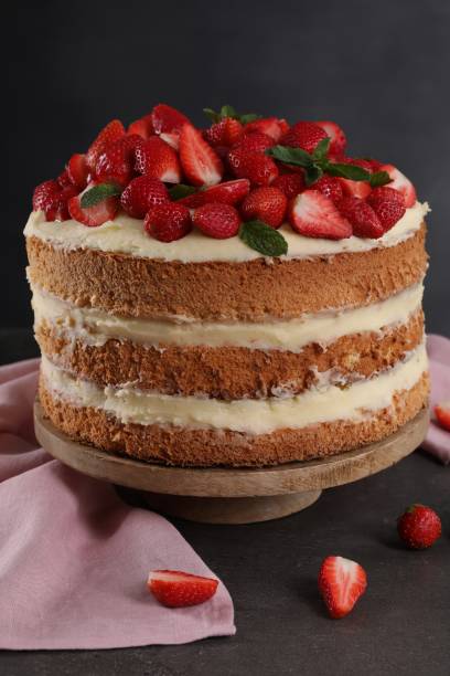 istock Tasty cake with fresh strawberries and mint on gray table 1838041247