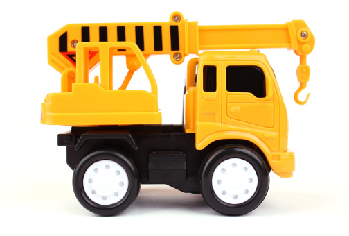 Toy truck with crane isolated on white background