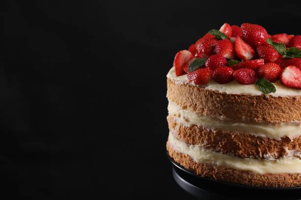 istock Tasty cake with fresh strawberries and mint on black background, closeup. Space for text 1838041776