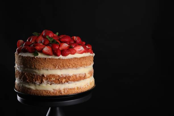 istock Tasty cake with fresh strawberries and mint on black background, space for text 1838041785
