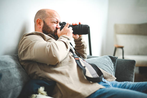 istock male photographer at work 1838042313