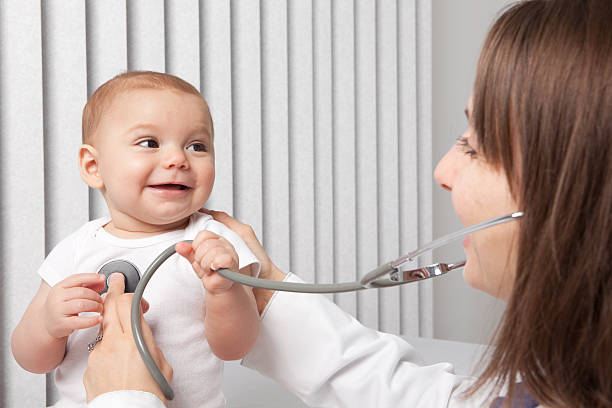 istock Pediatrician Listening To Baby's Heart 183805030