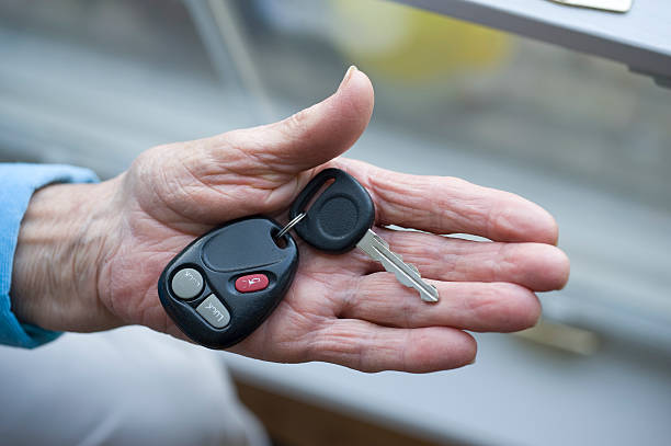 istock Elderly hand with car keys 183805089