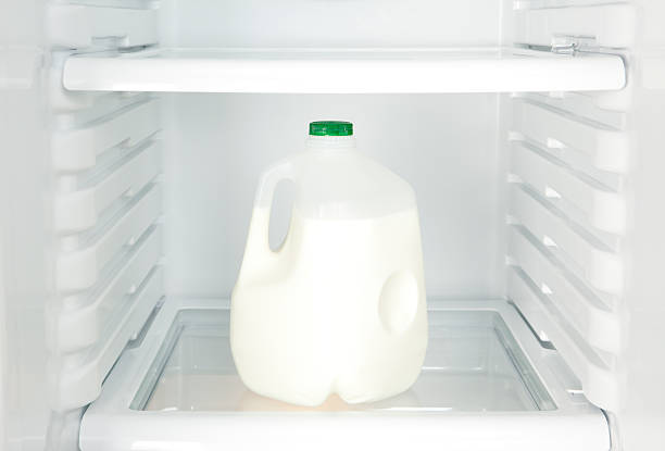 Gallon of Milk in Refrigerator "A gallon jug of milk inside of a refrigerator, close-up.Please also see:" in a gallon of milk stock pictures, royalty-free photos & images
