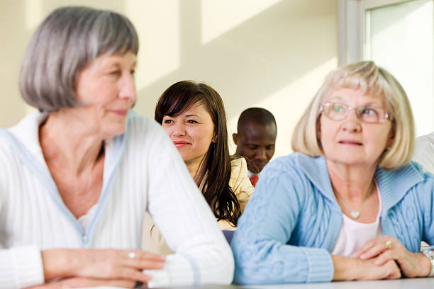 istock School for seniors... senior students having fun with computer 183805468