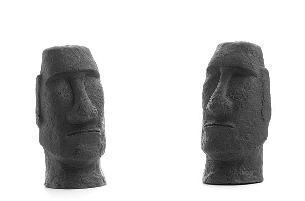 Two Easter island statue souvenirs on white background stock photo