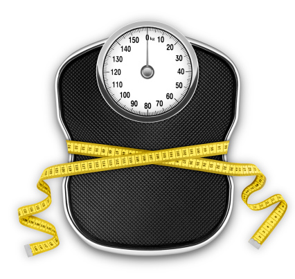 Diet concept. Scale slimmed by a measuring tape. Clipping path without shadow.