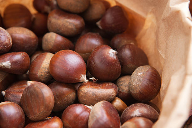 Delicious chestnuts in a paper bag stock photo