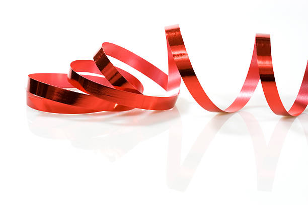red ribbon on white stock photo