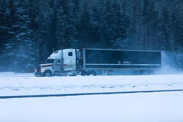 istock Truck driving through a snow storm 183805961