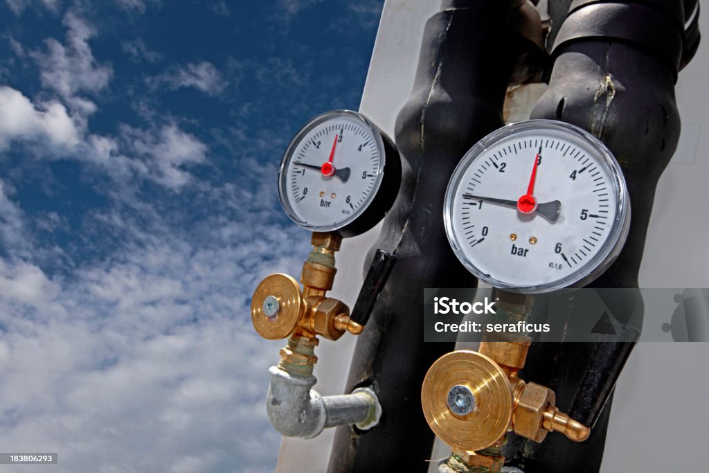 Air conditioning pressure gauges Pressure gauges of a heating and cooling system on a roof.  Other images in: Air Conditioner Stock Photo