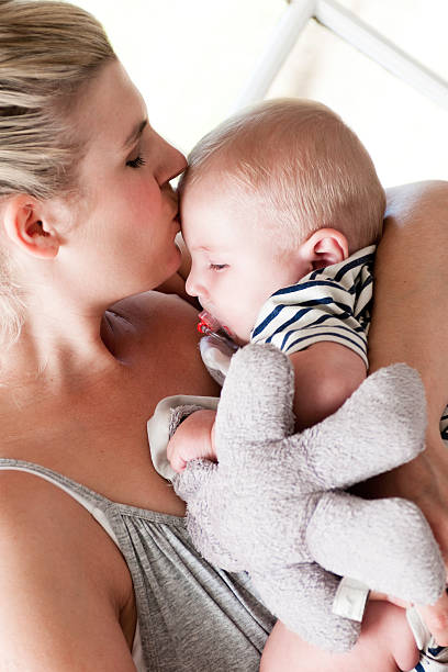 istock Cute baby boy with mother 183806424