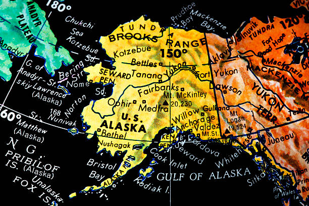 Vintage black ocean globe. Close up of the state of Alaska.