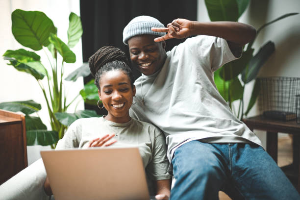 istock Man and woman using laptop 1838066772
