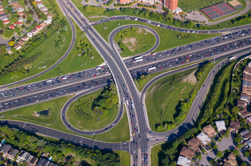 Aerial view of a gridlocked overpass on a large highway interchange.