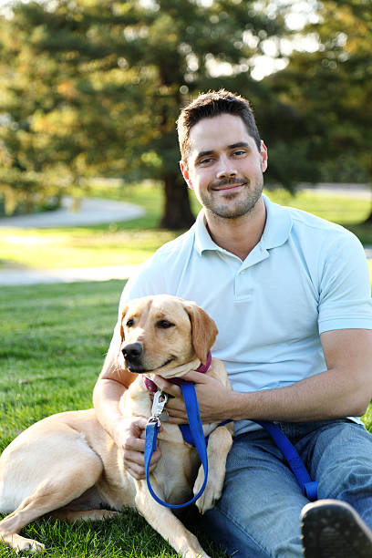 istock Man And Dog In Park 183807336